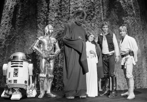 In this Nov. 13, 1978 file photo, shows, from left, Kenny Baker, Anthony Daniels, Peter Mayhew, Carrie Fisher, Harrison Ford, and Mark Hamill during the filming of the CBS-TV special 