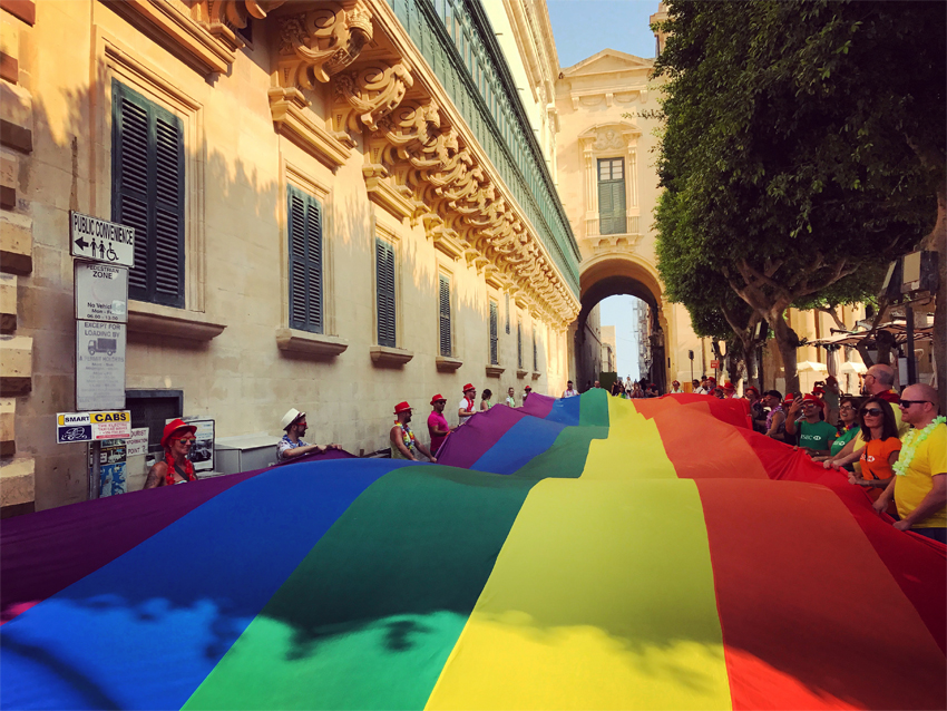 Two giant rainbow flags were paraded through the streets